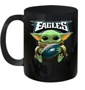 Baby Yoda Loves The Philadelphia Eagles Star Wars Baby Yoda Hugs Eagles NFL Ceramic Mug 11oz