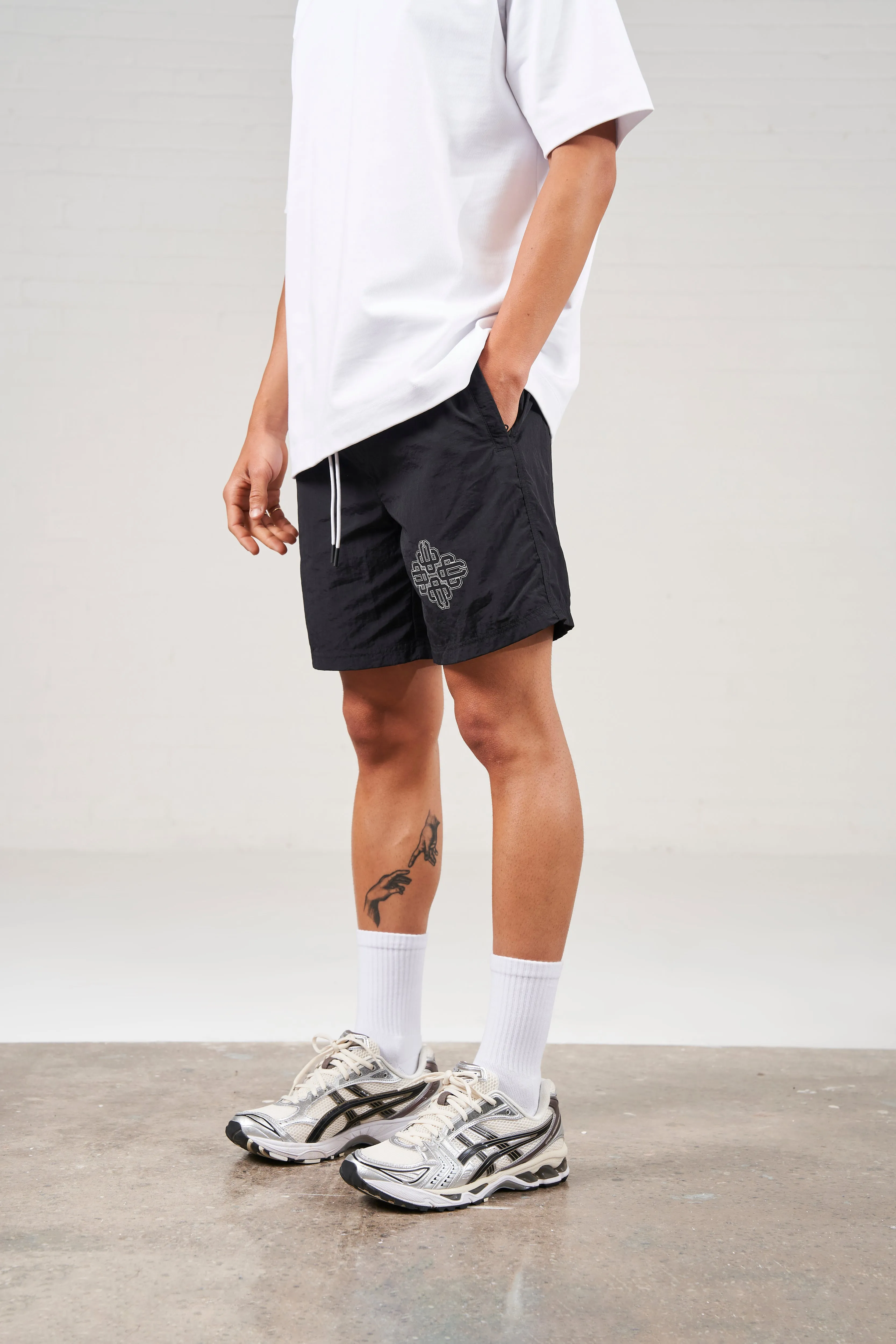 COPYRIGHT EMBLEM MID LENGTH SWIM SHORTS - BLACK